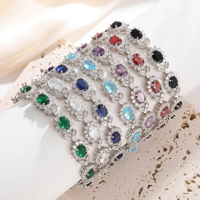 Personality Trend women's simple bracelet with inlaid zircon stones in a choice of nine gemstone colours on a wrist.