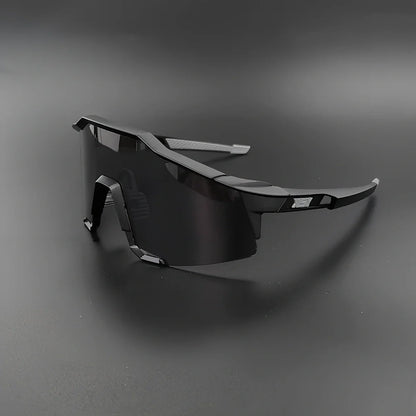 Cycling glasses with interchangeable lenses showing UV400 protection and lightweight frame design