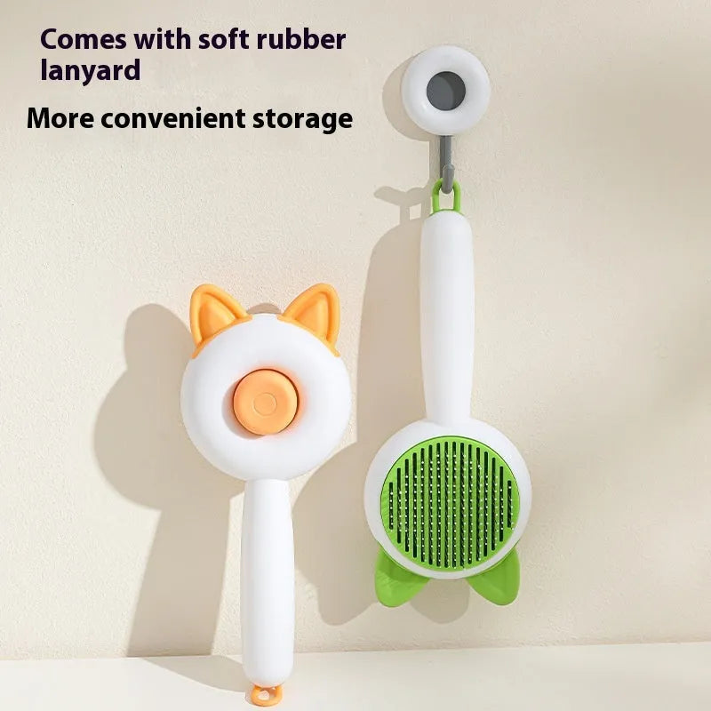 Greenish white pet grooming brush with stainless steel teeth, a push-button, and orange massage beads on the handle.