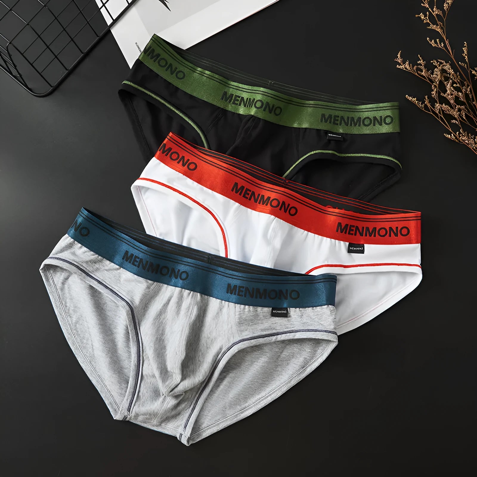 Men's low waist cotton briefs in a two-tone colour option on a plain background