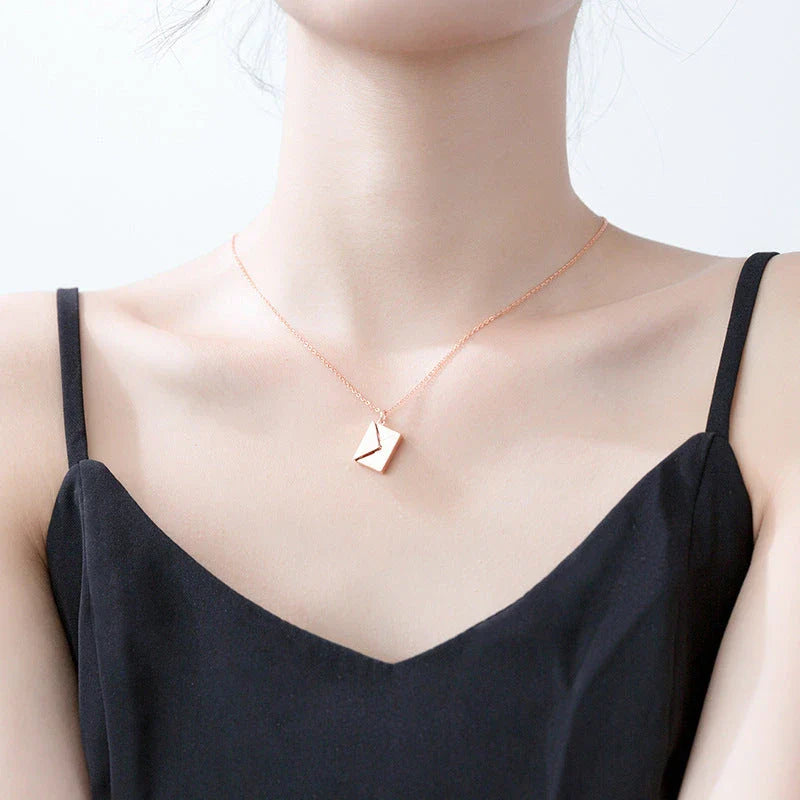 Stylish titanium steel envelope necklace with a discreet compartment for storing personal keepsakes