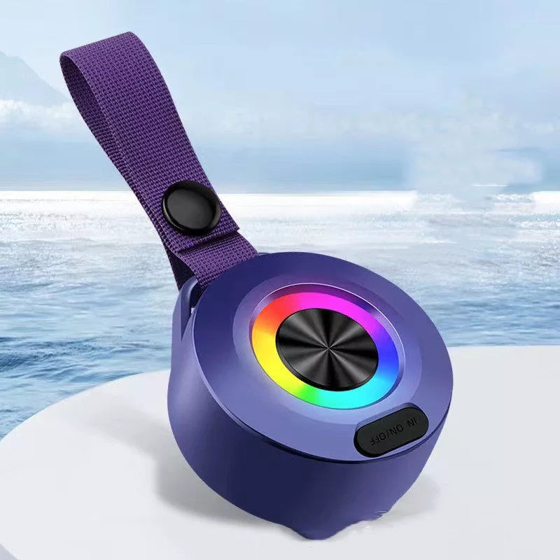 Portable Bluetooth speaker with colored lights and waterproof design