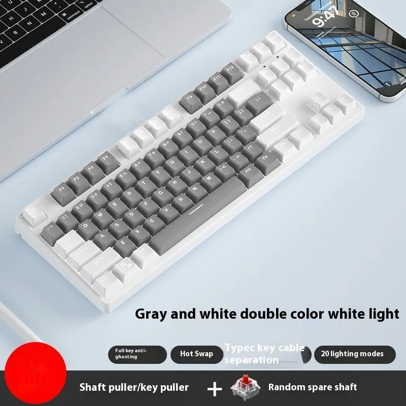 87-key mechanical keyboard with two-tone coloured keycaps on metal case