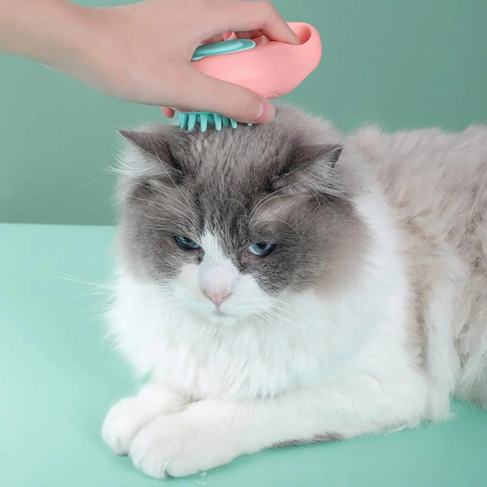 Claw-shaped pet grooming brush in pink, blue, yellow, and grey