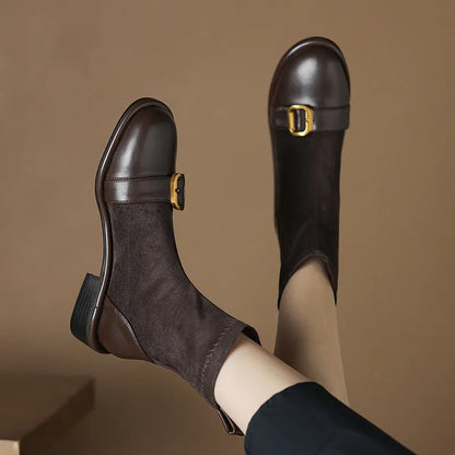 Women's black casual Martin boots with low heel, lace-up front, and decorative belt buckle stitching.