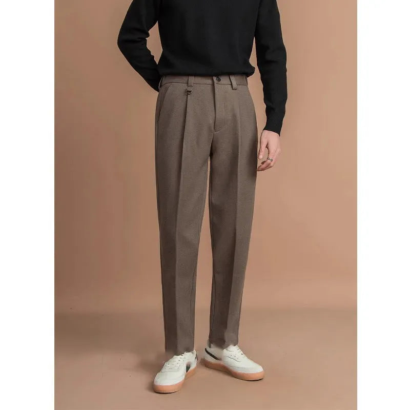 Man wearing straight cut draped polyester casual trousers in dark grey