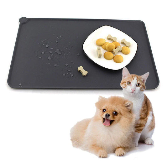 Silicone pet food mat with raised edges and non-slip base to contain messes and protect floors during pet mealtimes
