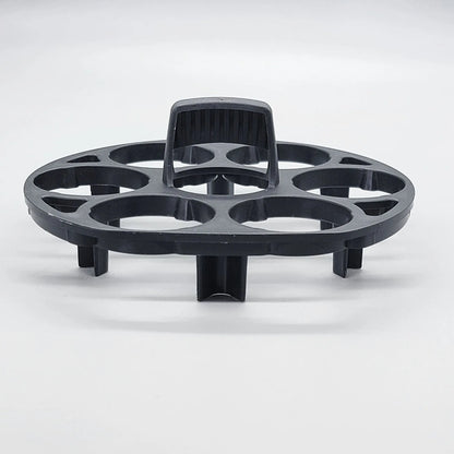 Black plastic egg holder rack for a cooking machine, shown from above.
