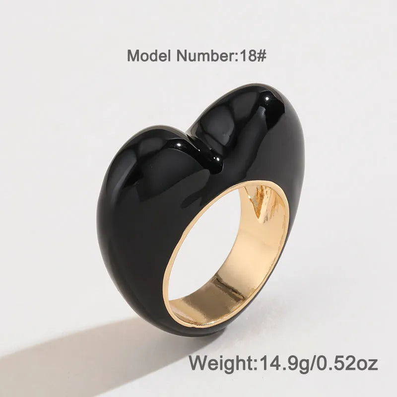 Heart-shaped enamel ring with three-dimensional detail in black, pink, purple, or red, sized for fingers 17-18
