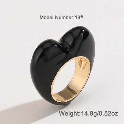 Heart-shaped enamel ring with three-dimensional detail in black, pink, purple, or red, sized for fingers 17-18
