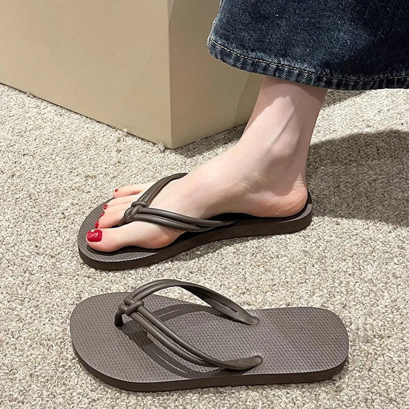 PVC injection moulded flip flops in toe-covering casual style with non-slip sole