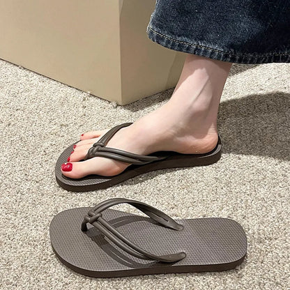 PVC injection moulded flip flops in toe-covering casual style with non-slip sole