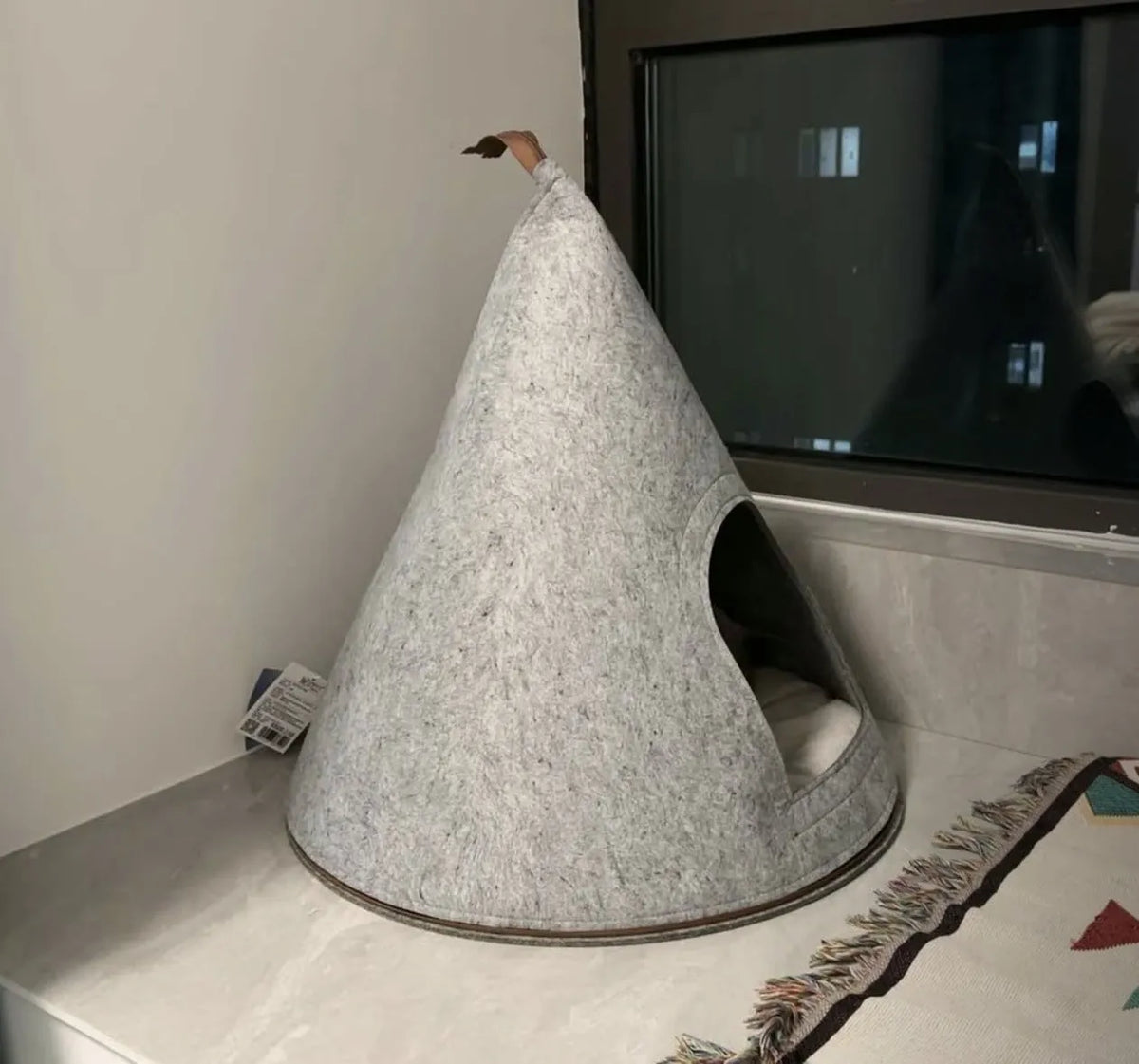 Grey felt cone-shaped cat house with tent design for indoor pets