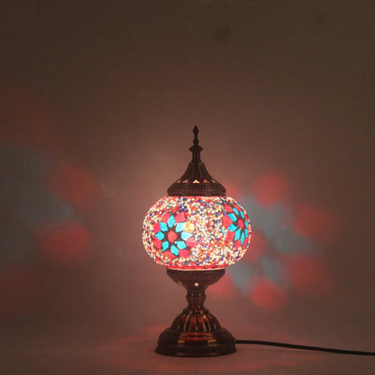 Glass table lamp with 150mm diameter shade and 330cm cord on wooden surface