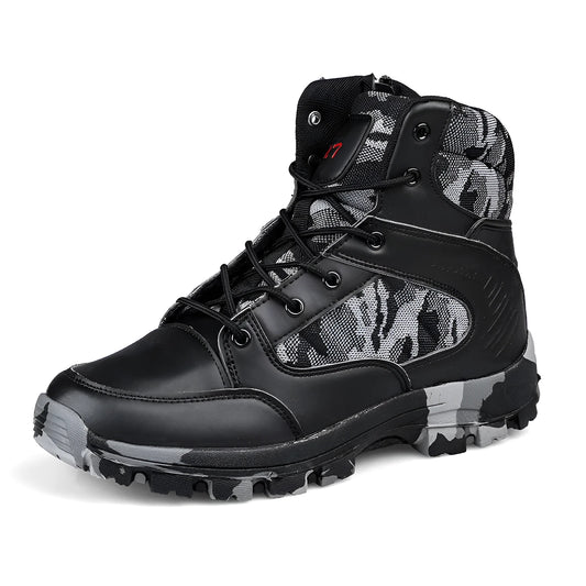 Men's black and camouflage high-top hiking shoes with PU upper and metal eyelets on a rocky outdoor path.