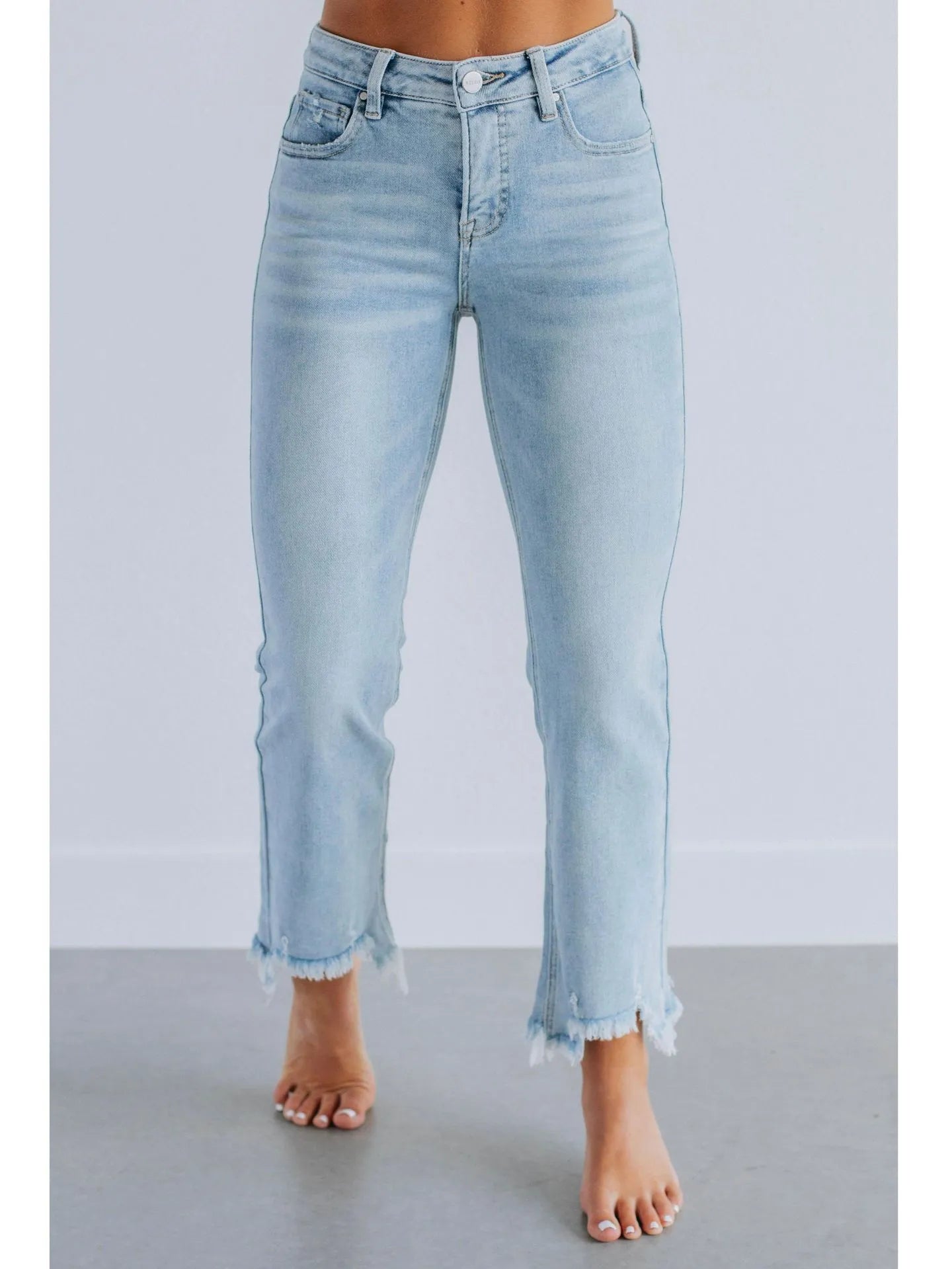 Women's solid colour denim trousers with hand-worn finish in dark blue, showing casual styling and 100% cotton construction