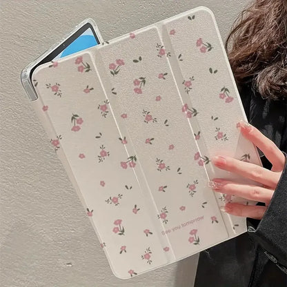 Transparent tri-fold iPad case with floral design, showing magnetic front cover and rear kickstand deployed.