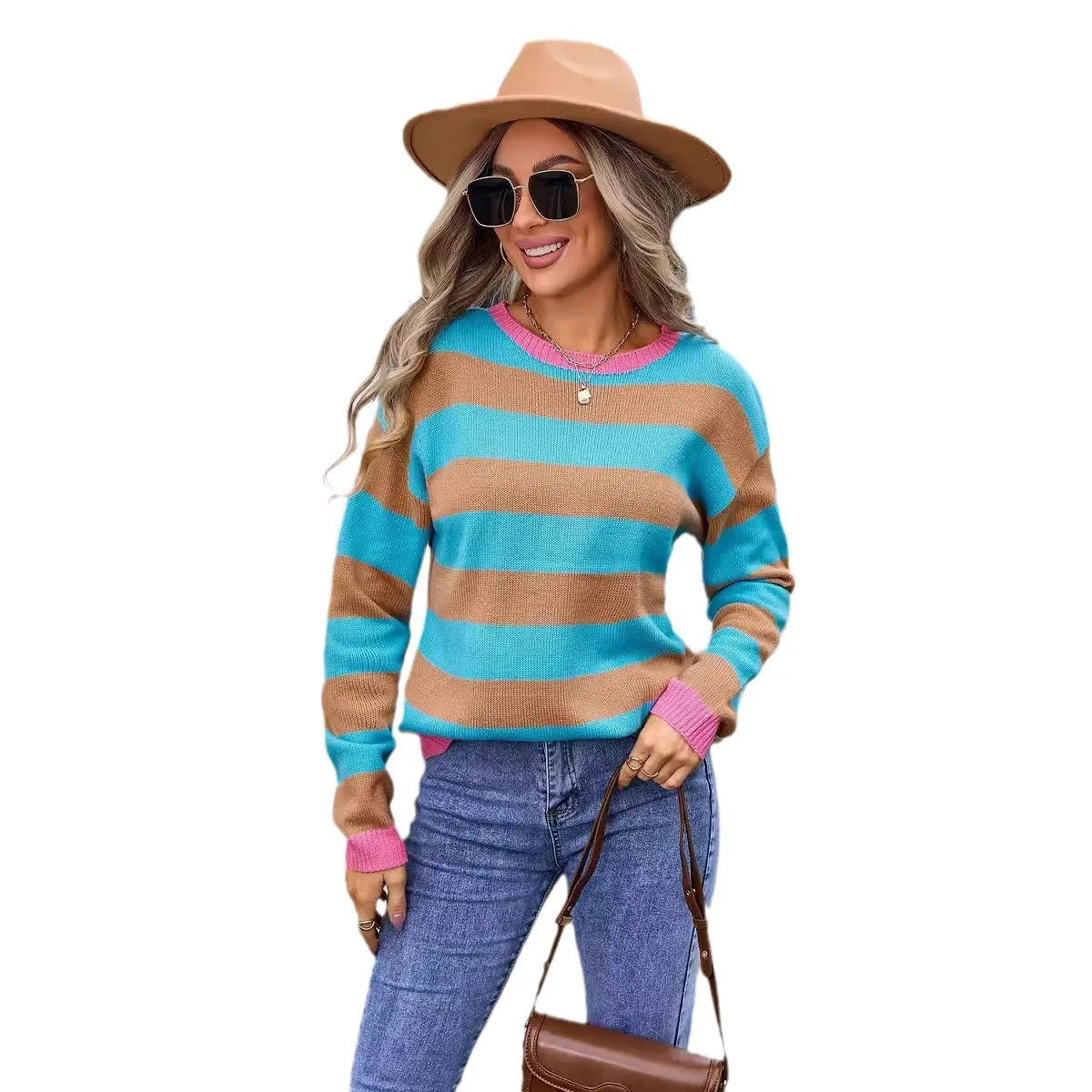 Women's loose fit striped long sleeve round neck sweater on a hanger.