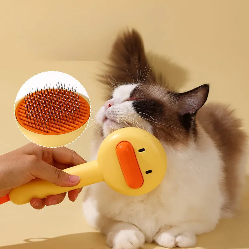Small yellow duck-shaped pet grooming comb with needle pins and open section design