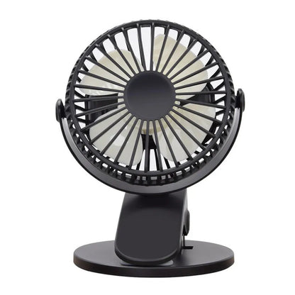 White USB rechargeable clip fan with plastic blades attached to a stroller handle.