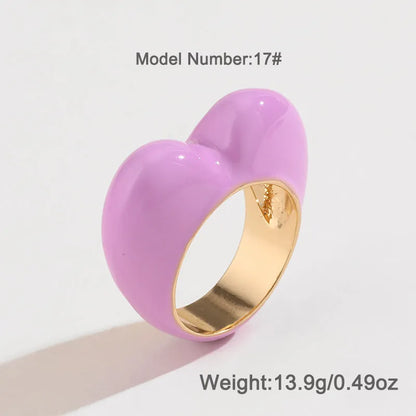 Heart-shaped enamel ring with three-dimensional detail in black, pink, purple, or red, sized for fingers 17-18