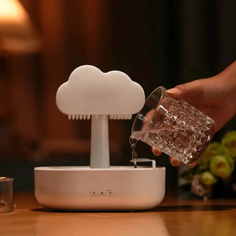 White rain cloud shaped humidifier with LED lighting and water droplet effect