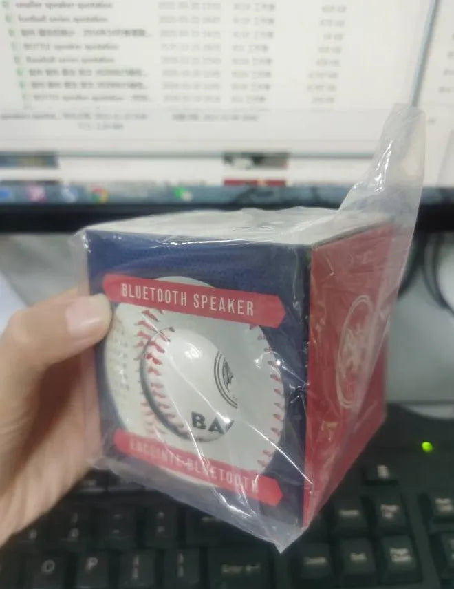 Baseball home design Bluetooth speaker in green colour showing front grille and USB port