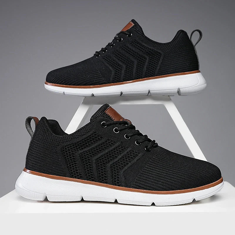 Men's black lace-up mesh sneakers with woven detail for casual and sports wear