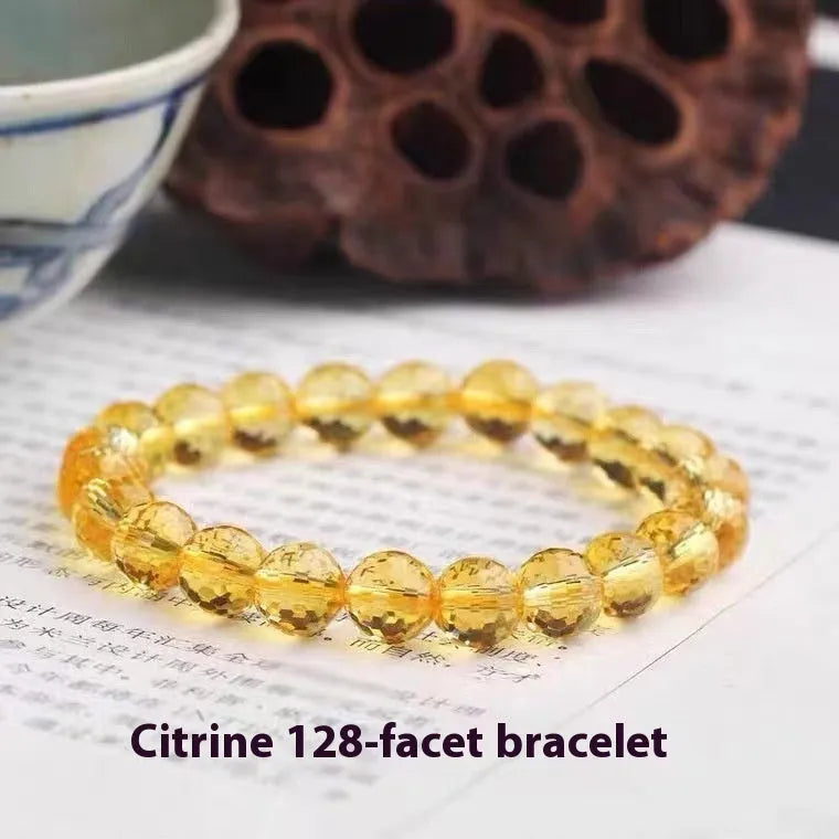 Handmade crystal bracelet with 128-cut gemstone beads and zodiac charm on wrist