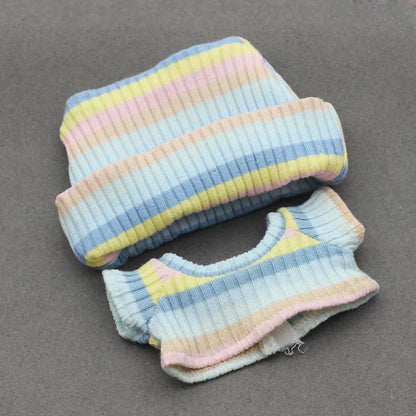 Doll clothes set with knitted flanging hat and T-shirt in multiple colours including pink, white, and stripes.