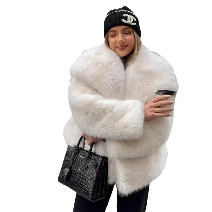 Women's white artificial fur coat with large lapel, long sleeves, and deep pockets shown in street fashion setting