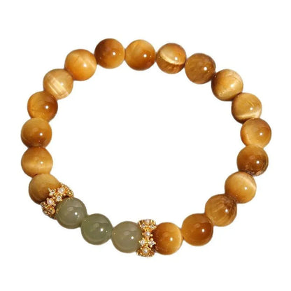 Natural yellow Tiger's Eye bracelet with Hetian jade elements and gold gourd charm on wrist