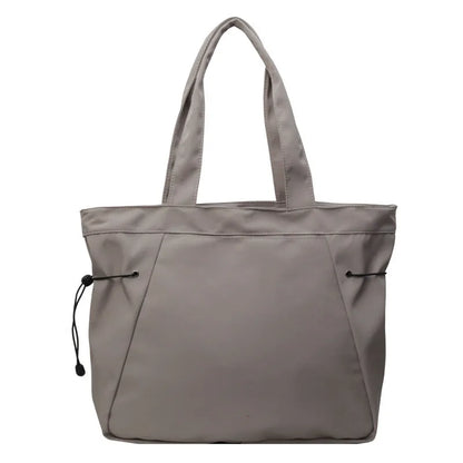 Soft Oxford cloth foldable commuter tote bag in street style, shown in multiple colour options.