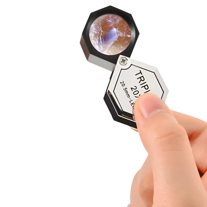 Handheld metal and optical glass magnifying glass for jewellery, stamp, and coin identification with 10x to 30x magnification.