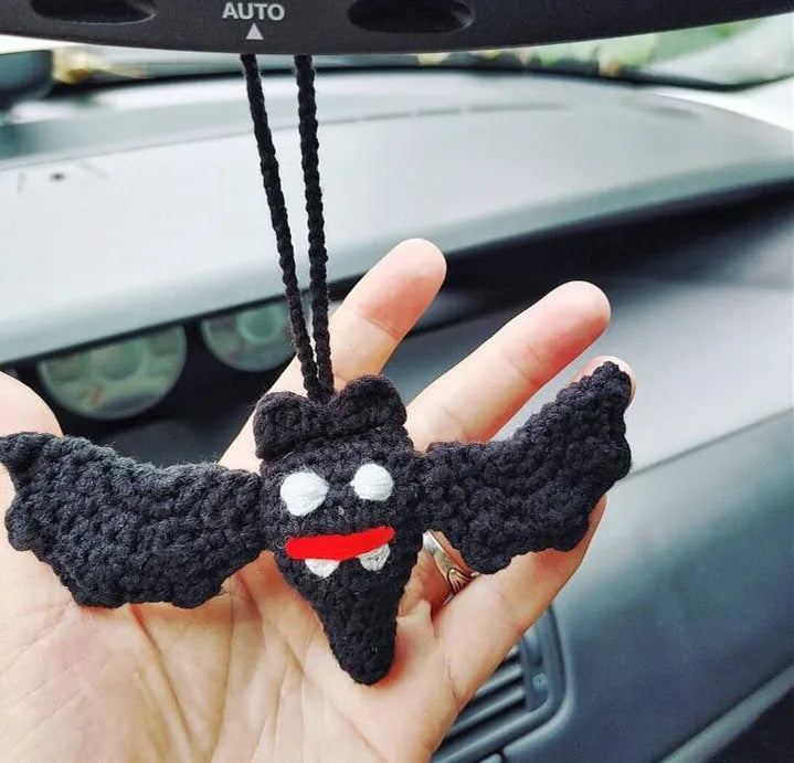 Soft, hand-woven plush car hanging ornament in a cartoon character design.