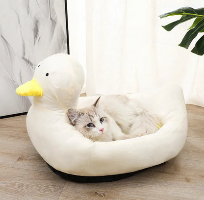 Blue duck shape fluffy pet bed sofa for small dogs and cats on a wooden floor