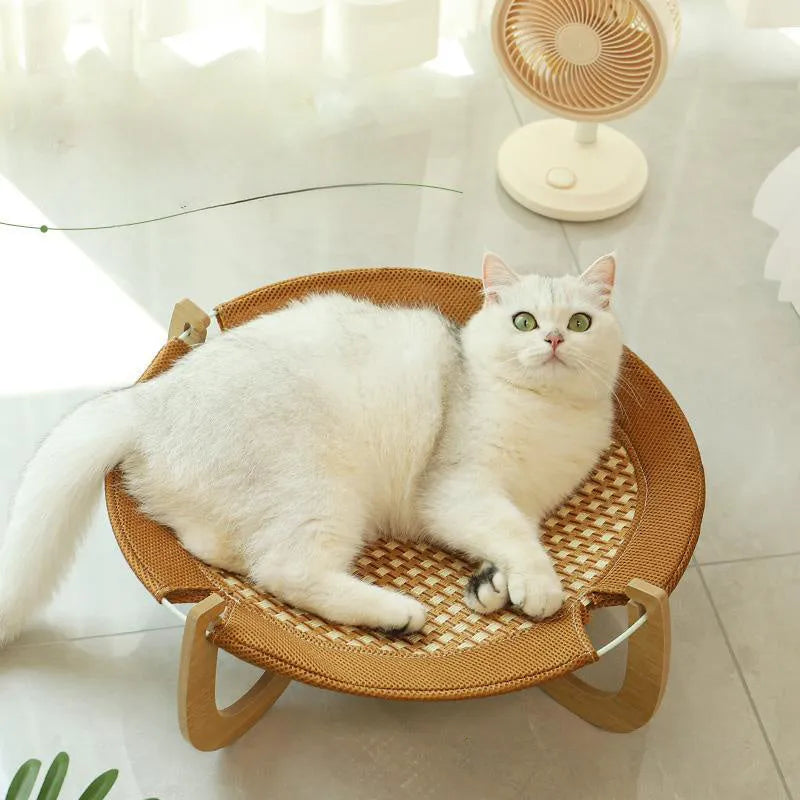 Brown square woven rattan pet hammock bed for cats and small dogs, shown off the ground.