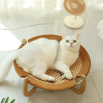 Brown square woven rattan pet hammock bed for cats and small dogs, shown off the ground.