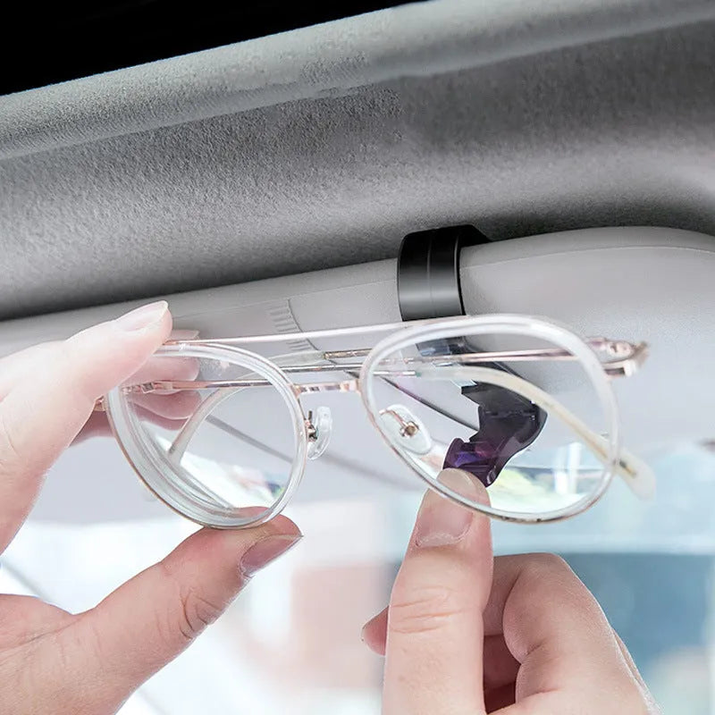 Black plastic car sun visor clip for glasses, tickets, and ID cards measuring 6.5cm long