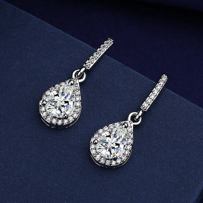 Elegant drop-shaped earrings featuring shimmering zircon stones in a variety of colors, including white, yellow, blue, and red diamond.