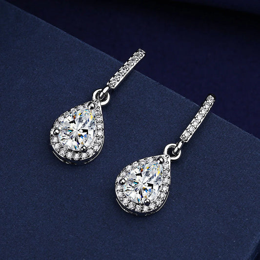 Elegant drop-shaped earrings featuring shimmering zircon stones in a variety of colors, including white, yellow, blue, and red diamond.