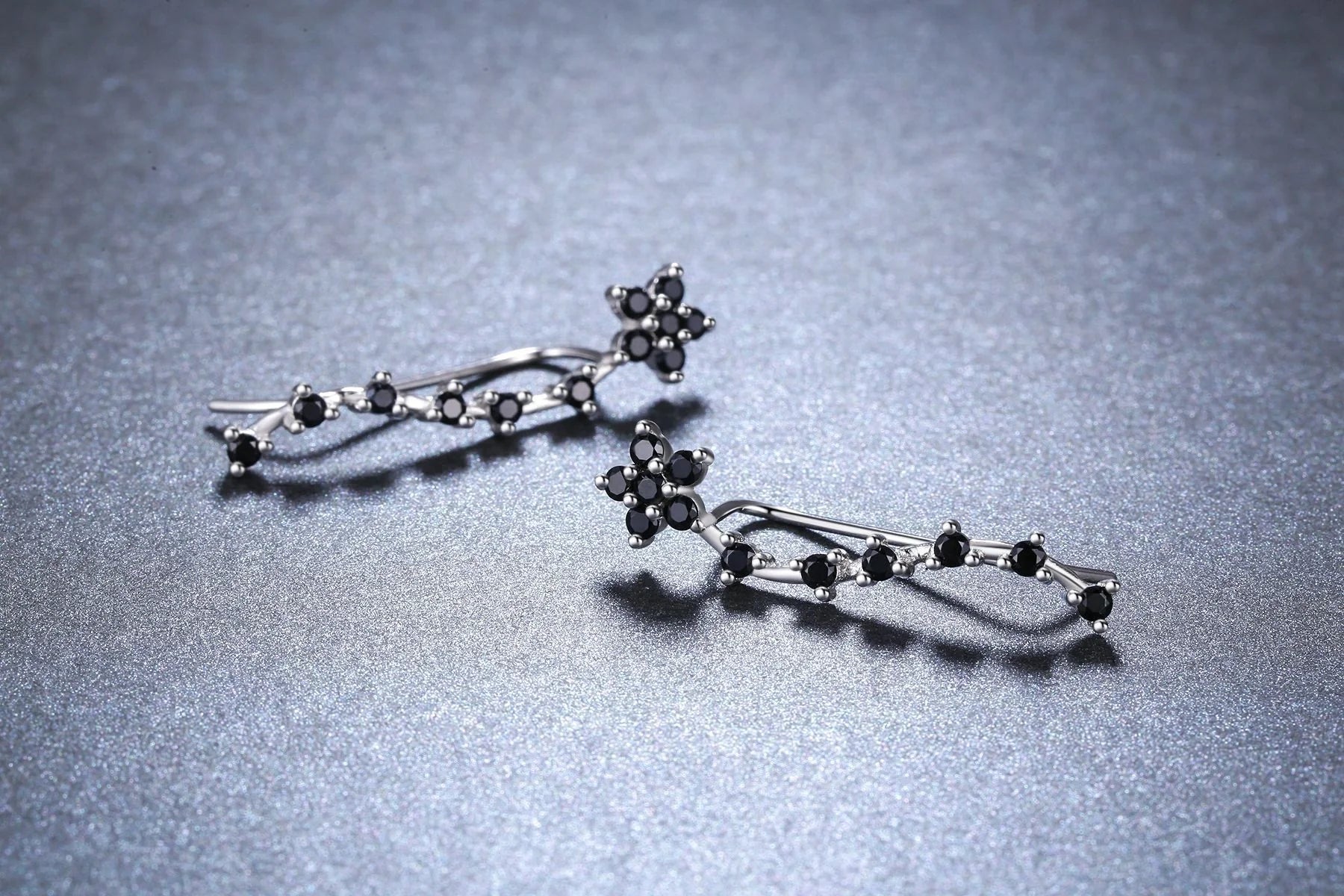 Women's long fringed zircon earrings in black with flower details and secure backing