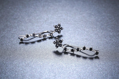 Women's long fringed zircon earrings in black with flower details and secure backing