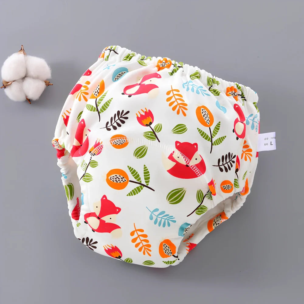 Washable baby training pants with 6-layer gauze construction in assorted patterns including animals and geometric designs