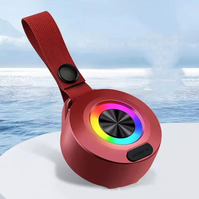 Portable Bluetooth speaker with colored lights and waterproof design