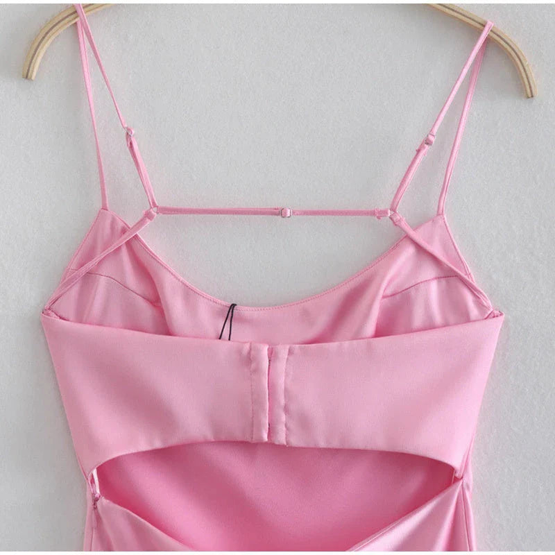 Elegant satin slip dress in pink with a flattering, form-fitting silhouette and sexy backless design