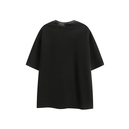 Purple washed cotton T-shirt with embroidery, loose fit, shown on a hanger.