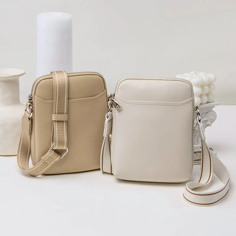Solid colour mobile phone bag with adjustable strap showing 14.5x5.5x19cm dimensions and PU material construction