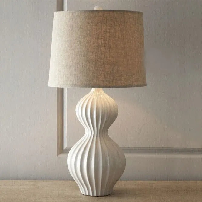 American country style ceramic table lamp with white fabric shade on wooden table