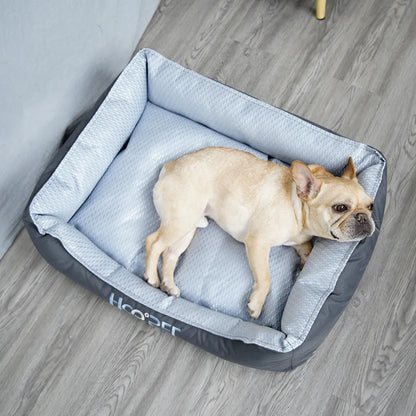 Soft grey dog bed with removable cover showing sizes for small, medium, and large pets